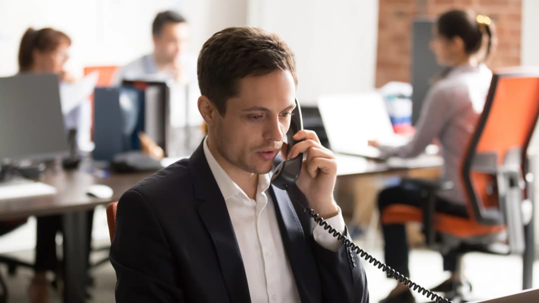 An outsourced SDR from UpliftGTM making a sales call for a B2B tech company.